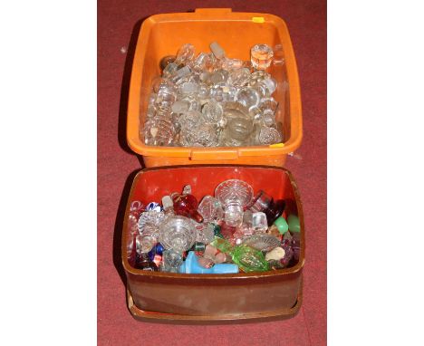A large collection of assorted decanter stoppers