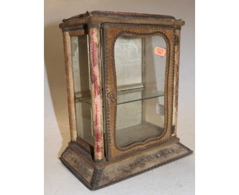 A Victorian felt covered table top display cabinet, having a single glass shelf enclosed by a glazed door, height 26cmAppears