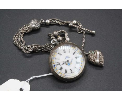 A late Victorian silver cased open faced pocket watch, having a jewelled white enamel dial, engraved back cover, keywind move