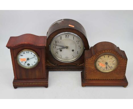 A 1930s oak cased mantel clock having a silvered dial with Arabic numerals and eight day movement, together with two other 19