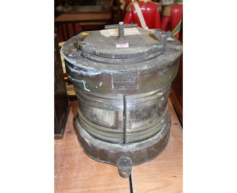 An Elizabeth II brass cased masthead lantern, reputedly removed from SS Methane Princess, bearing a label Meterorite C27167, 