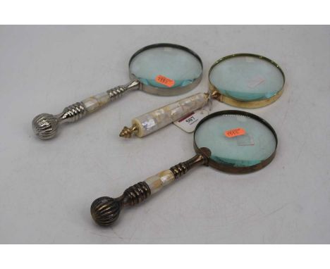 Three oversized magnifying glasses each with mother-of-pearl handles, 25cm