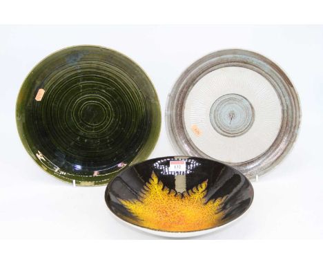A Poole Pottery dish in the Agean pattern on black ground with burnt orange and yellow leaf decoration, having printed mark v