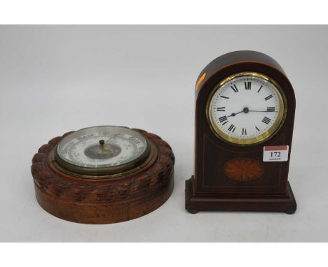 An Edwardian mahogany and boxwood strung dome topped mantel clock, having a convex enamel dial with Roman numerals, French cy