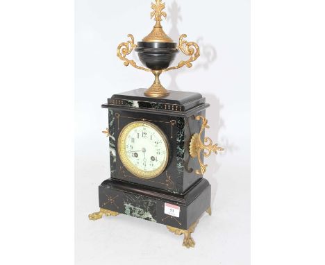 A late 19th century black slate and marble cased mantel clock, surmounted by an urn having a circular enamel dial with Arabic
