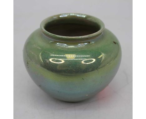 A Moorcroft Burslem green lustre vase, of squat baluster form, h.6cm