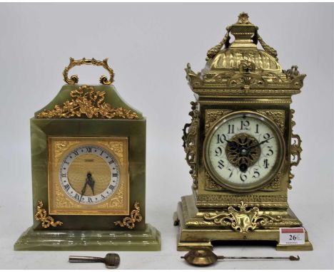 A 19th century brass cased mantel clock having a caddy type top with shell finial, above an enamelled chapter ring with Arabi