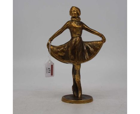 An Art Deco gilt painted sculpture novelty table lighter, modelled as a standing female ice-skater, with hinged cover and rai