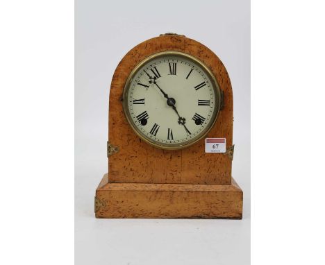 A 19th century continental burr oak cased dome topped mantel clock, having enamelled dial with Roman numerals, eight-day move