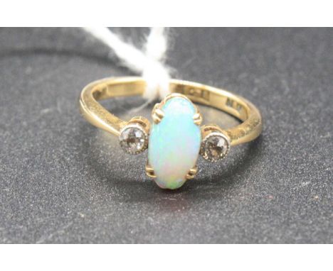 An 18ct gold, opal and diamond three-stone ring, 2.9g, size L