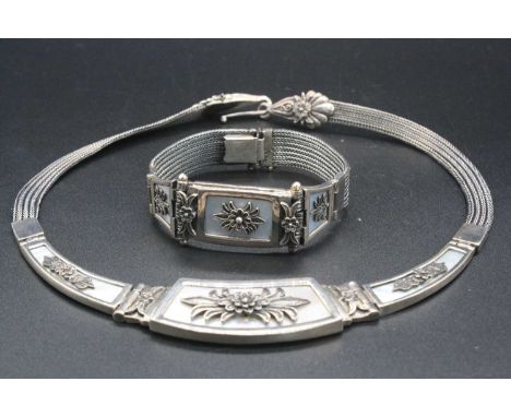 A contemporary white metal and mother of pearl necklet with matching bracelet, each having panelled and meshlink sections, st