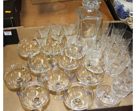 A collection of cut glass drinking glasses and a decanter 