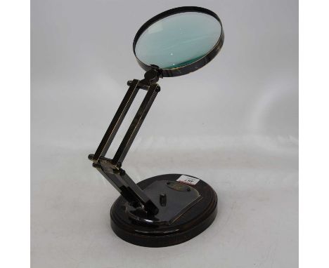 A reproduction adjustable table top magnifier