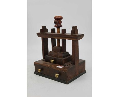 A 19th century Welsh oak table top flower press having adjustable screw top with single drawer below, width 27cm