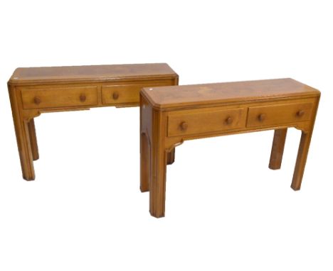 A pair of reproduction oak and pollard oak Celtic style hall tables raised on chamfered square sectioned supports, width 122c