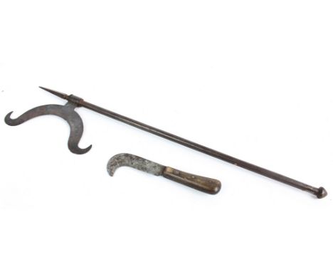 A 19th century iron axe with faceted pike, length 74cm, and a steel handled pruning knife by Joseph Rodgers & Sons, length 23