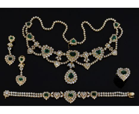 An impressive 18ct yellow gold diamond and emerald suite of jewellery comprising necklace with seven heart shaped emeralds an