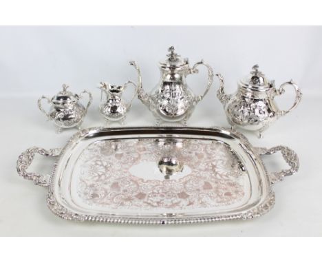 An electroplated four piece tea service of bellied form with floral and foliate decoration and floral finials and a large twi
