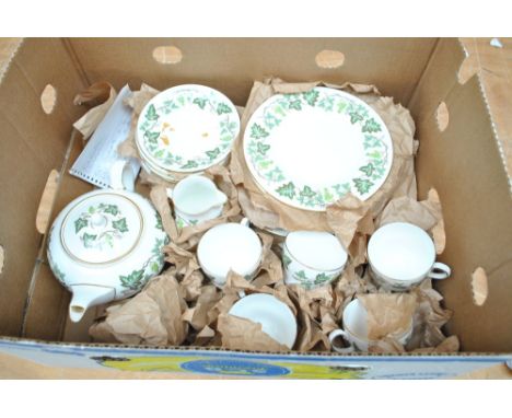 A Wedgwood 'Santa Clara' pattern part dinner service comprising dinner plates, side plates, sandwich plate, serving plates, c