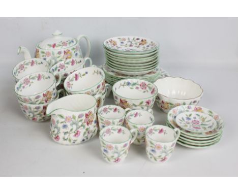 A Minton 'Haddon Hall' pattern tea and part coffee set comprising teapot, milk jug, two bowls, eight cups and saucers (two of