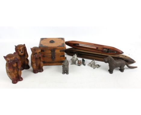 A small group of predominantly wooden collectors' items to include three wise monkeys, two weaving shuttles (one converted to
