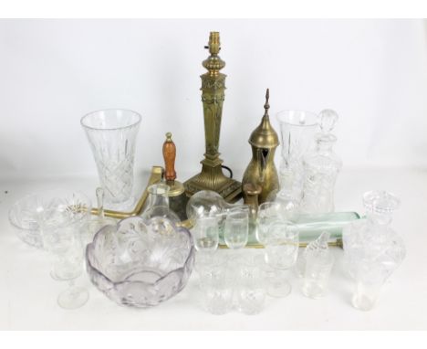 A small group of brassware to include a bell with wooden handle, a classical decorated table lamp and an Eastern coffee pot, 