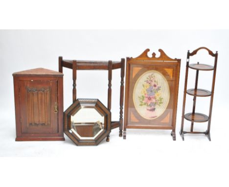 An inlaid mahogany firescreen, oak cake stand, hall stand, corner cupboard and octagonal mirror (5).