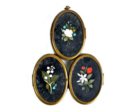 A 19th century Italian pietra dura floral decorated gilt metal mounted triple photograph frame, each oval aperture 8.5 x 5.5c