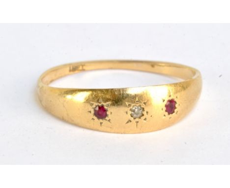 An 18ct yellow gold three stone ring, ring size R, approx 2.4g.