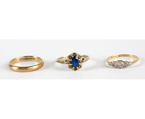 A 9ct yellow gold wedding band, size P, approx 2.6g, a 9ct yellow gold dress ring set with blue and white stones, size O, app