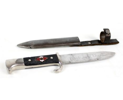 A Third Reich Hitler Youth dagger with enamelled insignia to chequered grip, the blade with stylised inscription 'Blut Und Eh