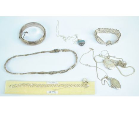 A quantity of silver costume jewellery including hinged bangle, gate link bracelet etc.