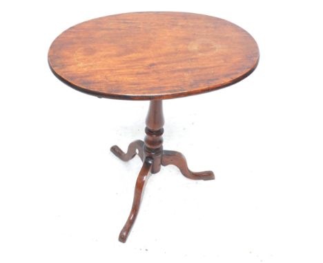 A 19th century mahogany oval tilt top table on tripod base, width 65cm.