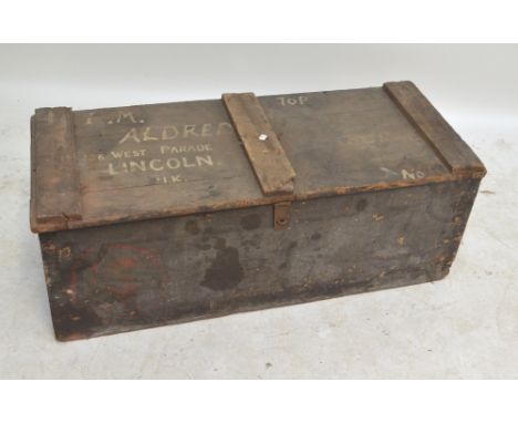 A painted wooden trunk, inscribed 'Aldred', width 112cm, and a vintage toy rail track, a Hornby speedboat and a wicker basket