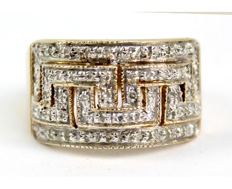 A 9ct yellow gold ring paved with melee diamonds with a Greek key motif, size P, approx. 3.9 grams.