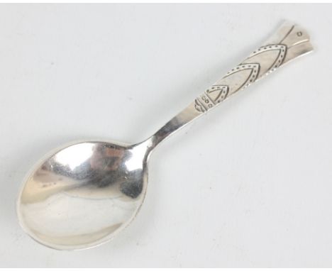 LIBERTY & CO; a George V hallmarked silver caddy spoon with tapering incise decorated and hammered stem, Birmingham 1924, num
