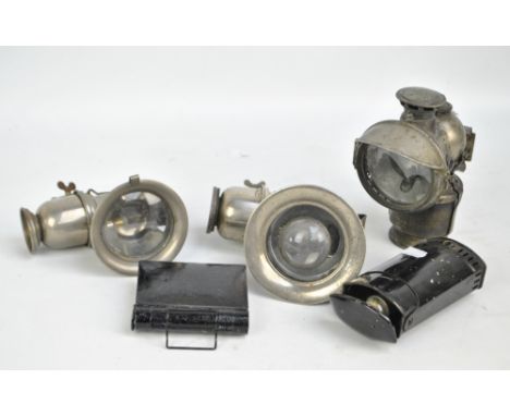 A vintage Lucas Acetyphote lamp numbered 317, two further lamps and two tin lamps (5).