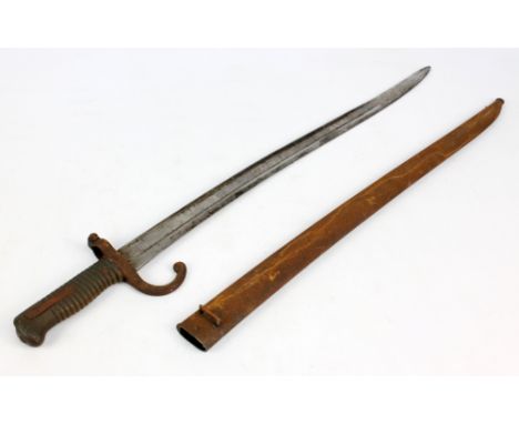 A late 19th century French bayonet with scabbard, blade engraved 'Mie Nnt le de St Etienne 8bre 1870', length of blade 57cm.