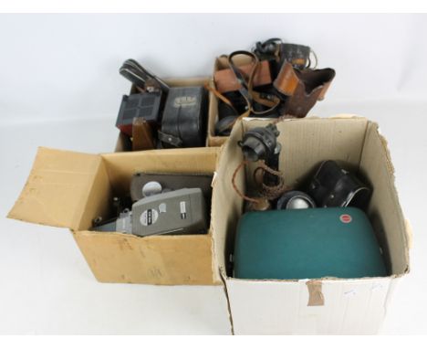 A collection of various cameras, projectors and binoculars, also three metronomes (af), a candlestick telephone and a 'Perfec