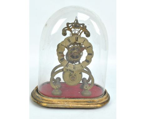A late 19th century brass skeleton mantel clock with single fusee movement, the shaped circular dial set with Roman numerals,