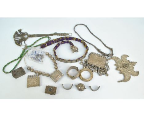 A collection of various Persian and Indian white metal items comprising various Koran boxes, the largest with applied bosses 