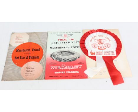 Four items of Manchester United memorabilia comprising a rosette and card bearing Matt Busby's signature with enclosed ticket