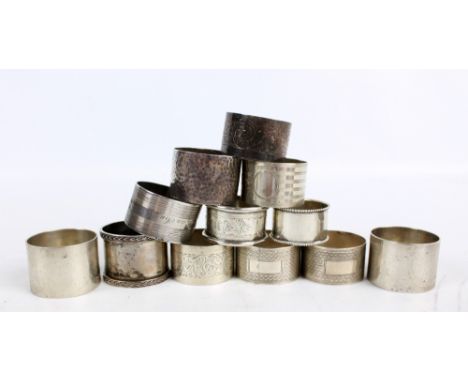 SW SMITH & CO; a pair of George V hallmarked silver circular napkin rings of plain form, Birmingham 1923, diameter 4.5cm, ano