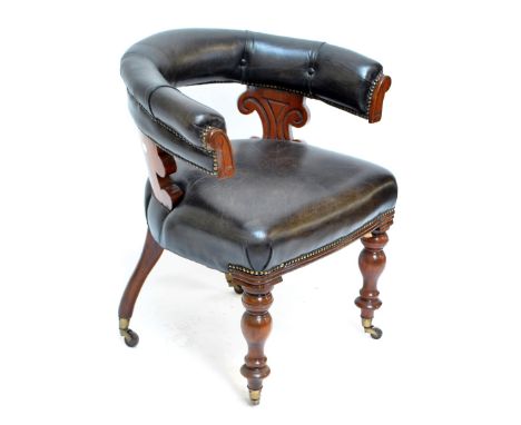 A late Victorian mahogany and leather upholstered tub chair with padded back and seat and ring turned baluster front legs to 