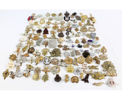 A collection of over one hundred military cap badges including Royal Welch Fusiliers, Worcestershire, South Staffordshire, De