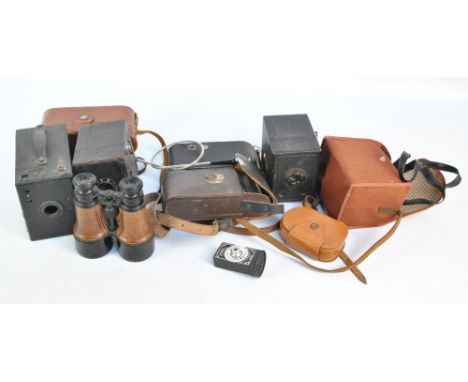 A quantity of vintage cameras comprising a 620E Kodak bellows camera, a Box Brownie, a Wirgin bellows camera, a Coronet Twelv
