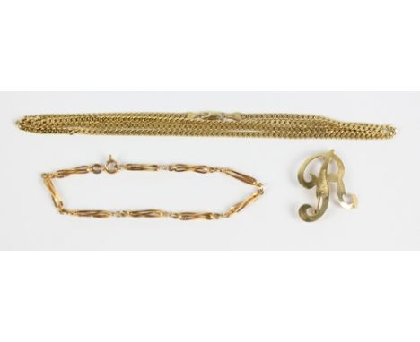 A 9ct yellow gold flat link chain necklace, length 59cm, a 9ct yellow gold fancy link bracelet, length 18cm and a 14ct yellow