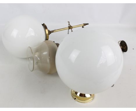 A brass white opaque glass globular ceiling light fitting, diameter approx 22cm, a similar pendant example and another with P