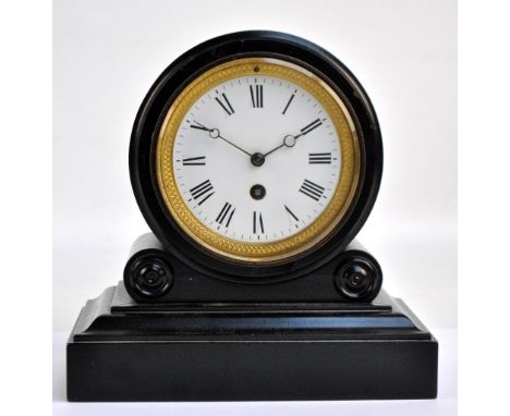 A late 19th century ebonised mantel clock, the white enamel dial set with Roman numerals, movement inscribed 2071, on stepped