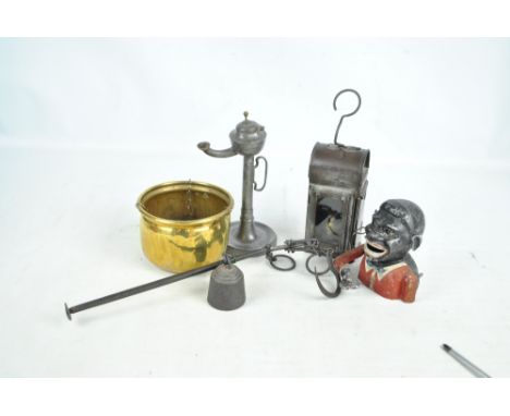 A wrought iron steelyard balance with hammered brass bowl, length 40.5cm, a painted aluminium Jolly money box, a pewter table